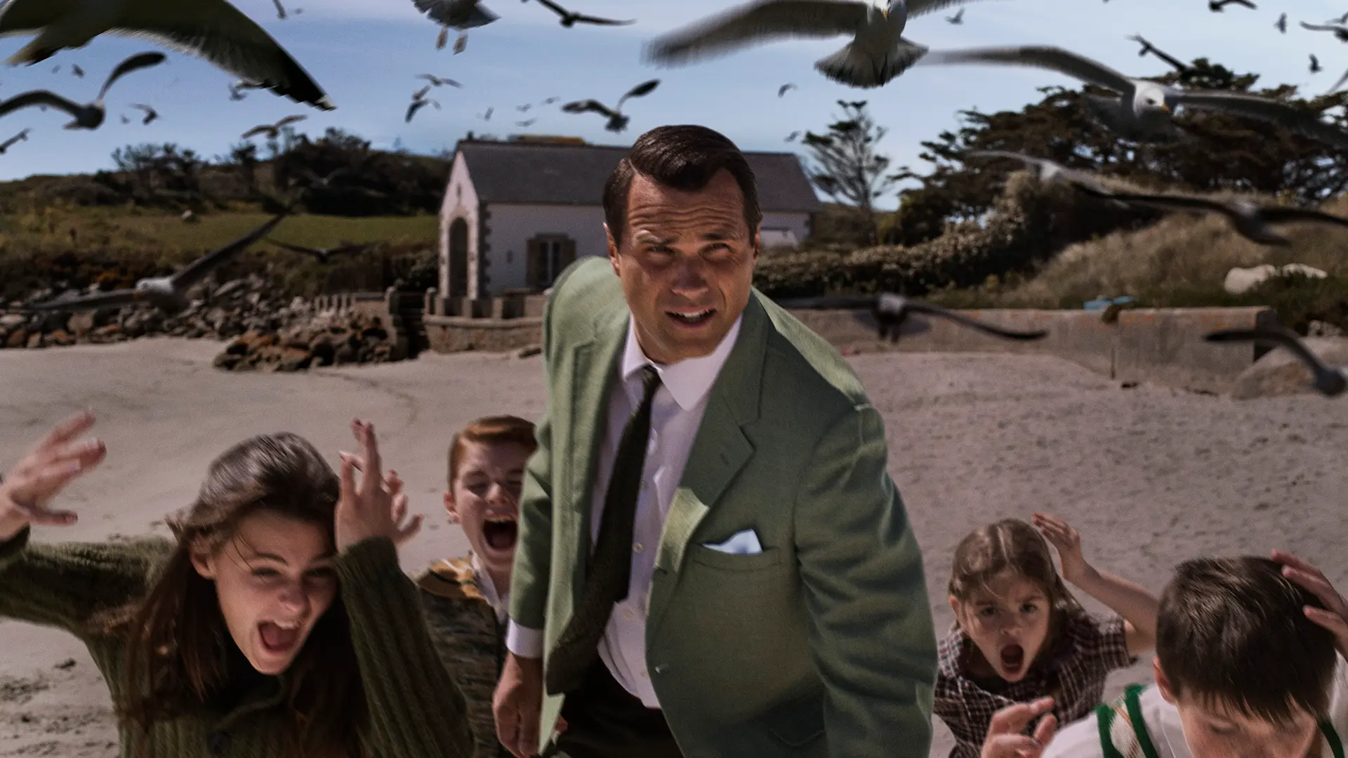 A man and five kids running away from crows 