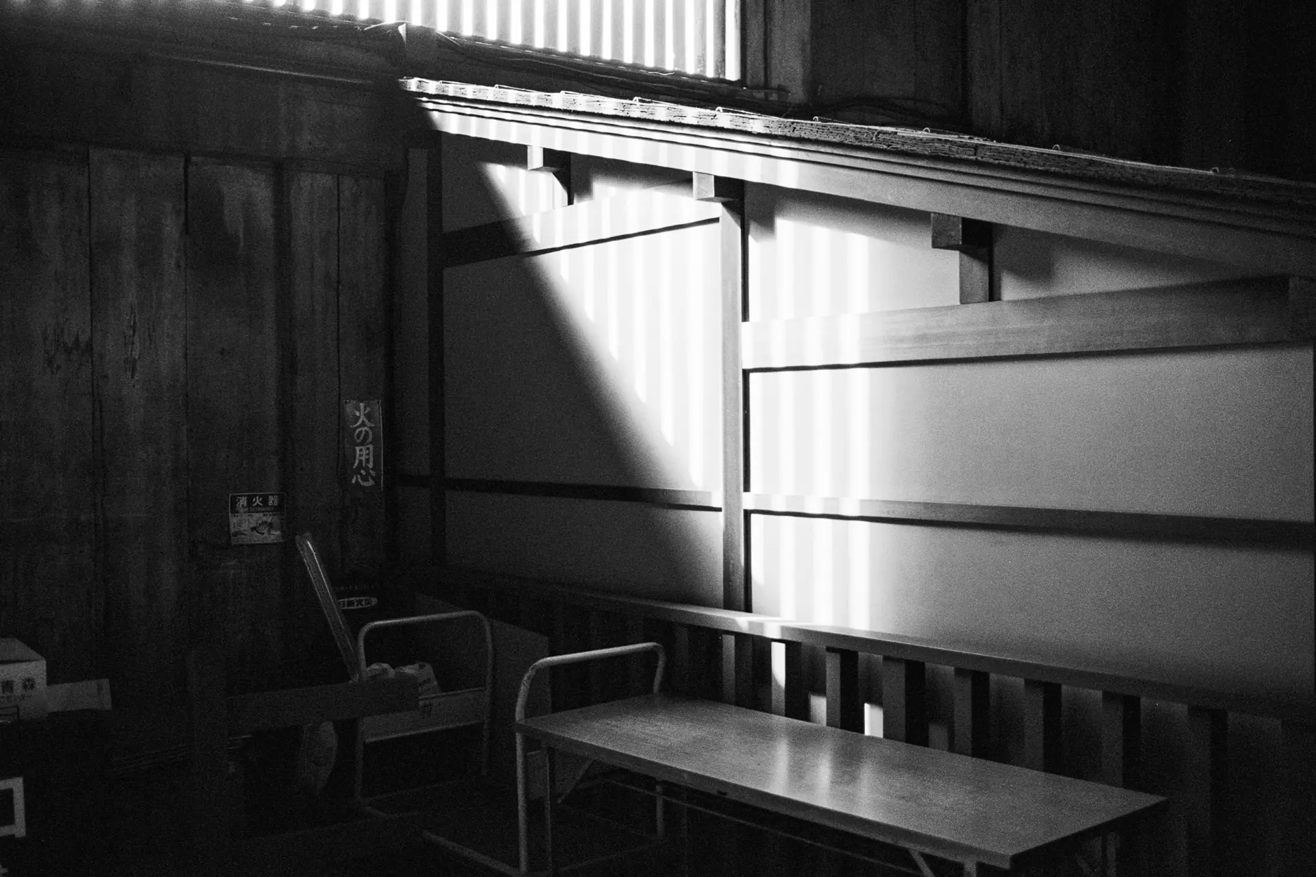 A chair and a bank inside a japanese house.