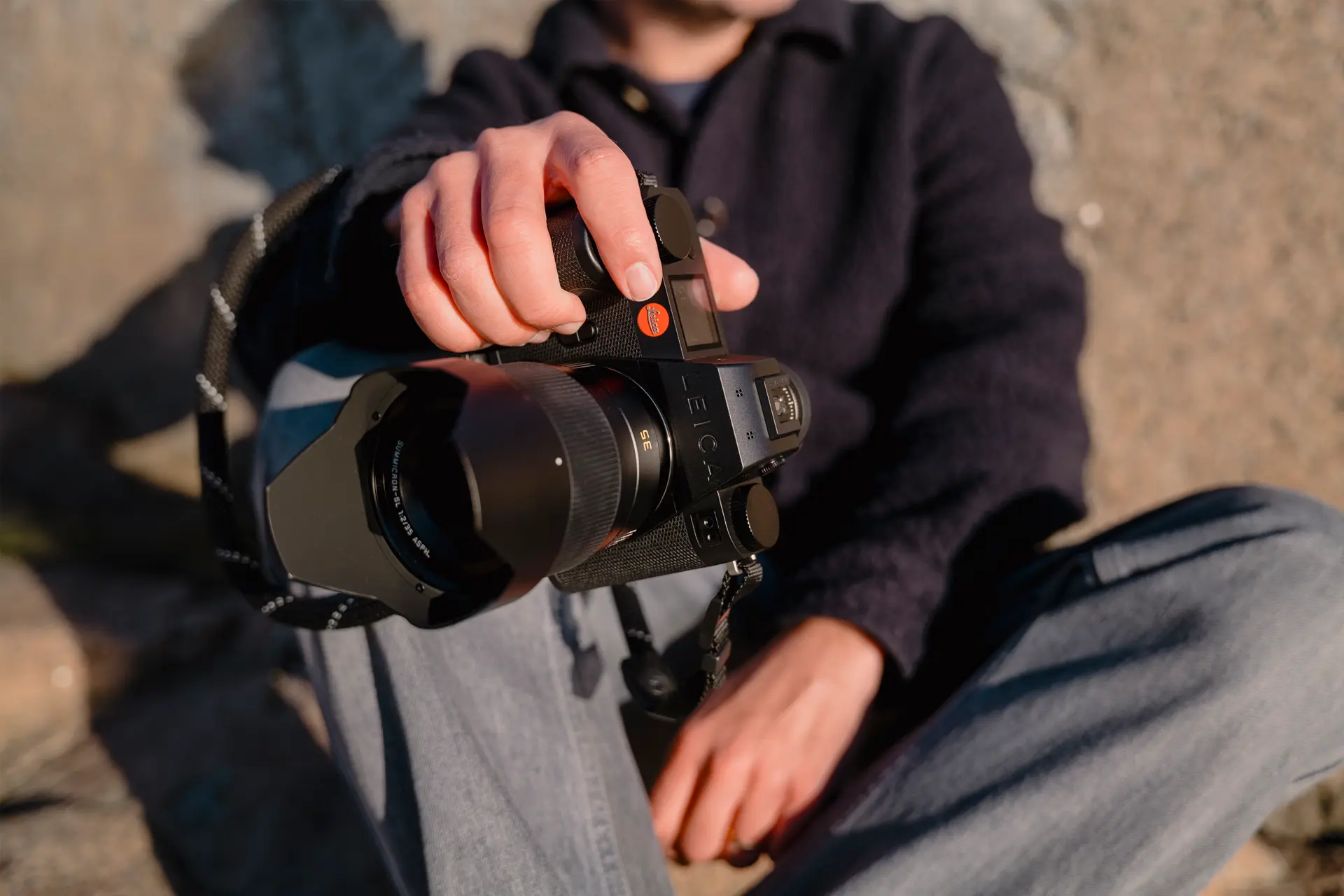 A person is holding the Leica SL3-S