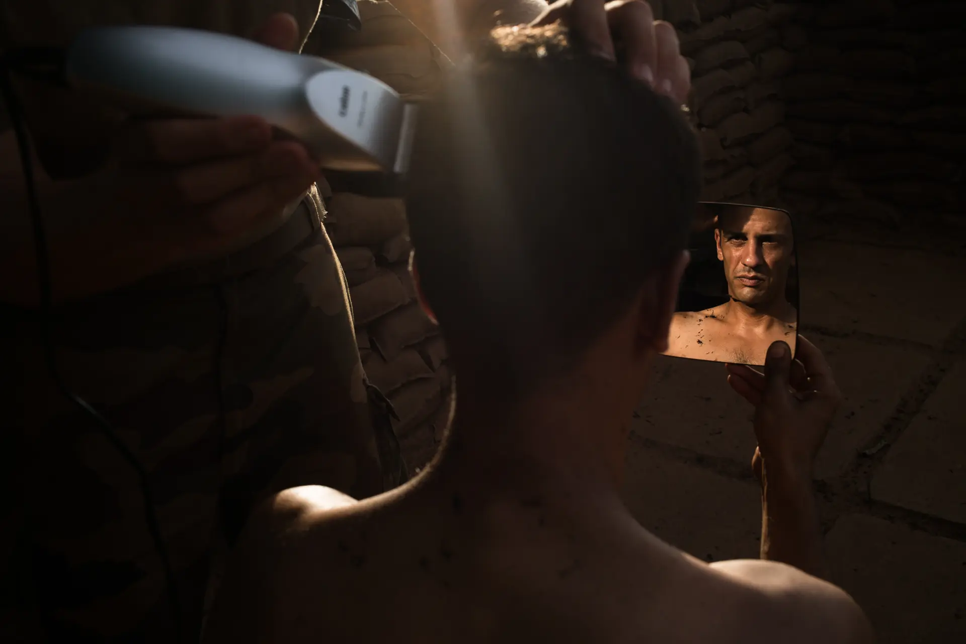 Soldier has his hair shaved off, taken in 2014 in the Central African Republic during the civil war