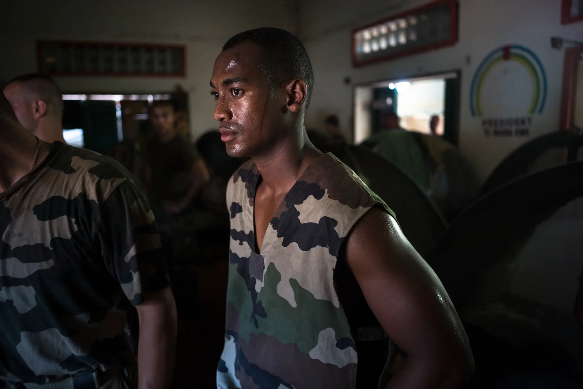 Close-up of a soldier in a room with other soldiers, taken in 2014 in the Central African Republic during the civil war