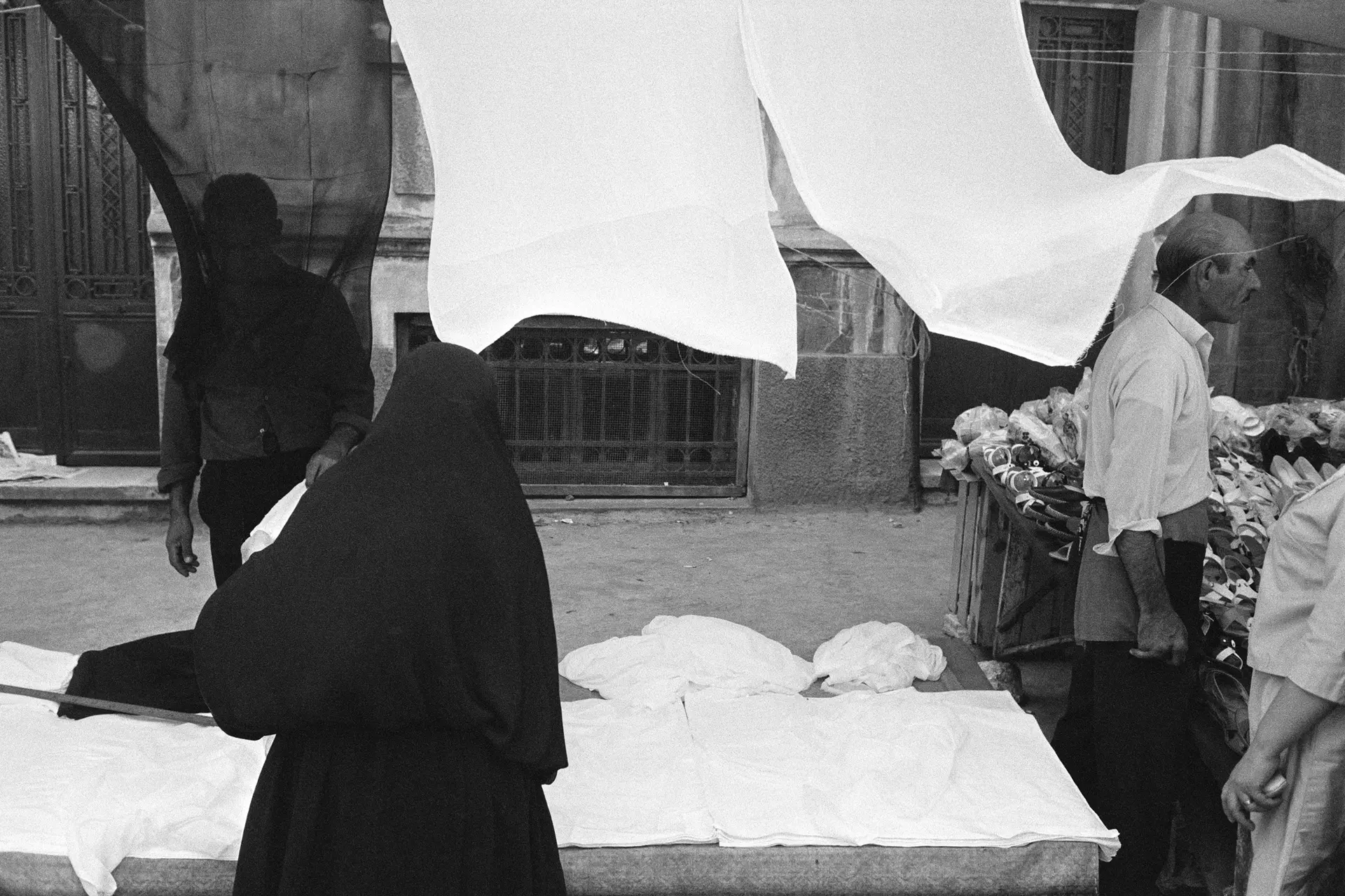 masked woman at a bazaar