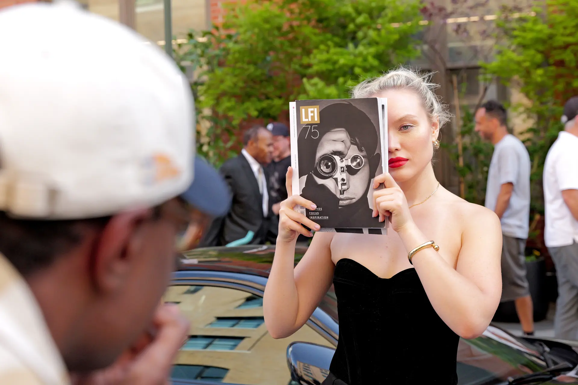 women with a book infront of her face