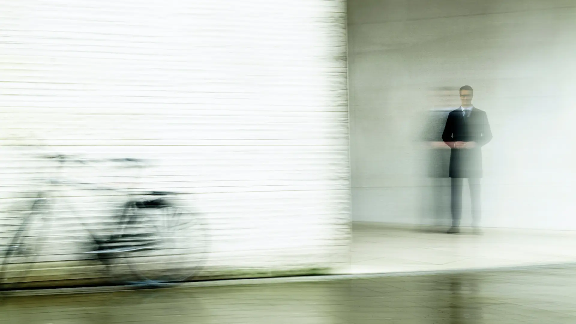 Blurred image of a man and a bicycle