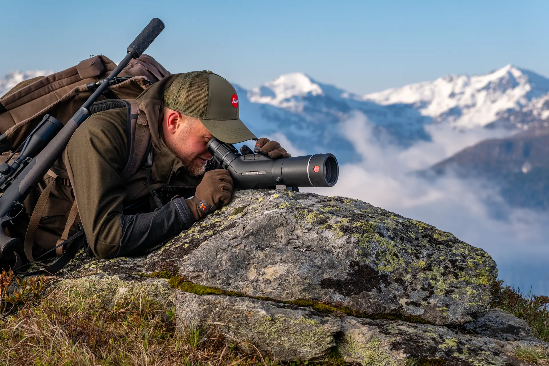 Man is looking through his Televid spotting scope
