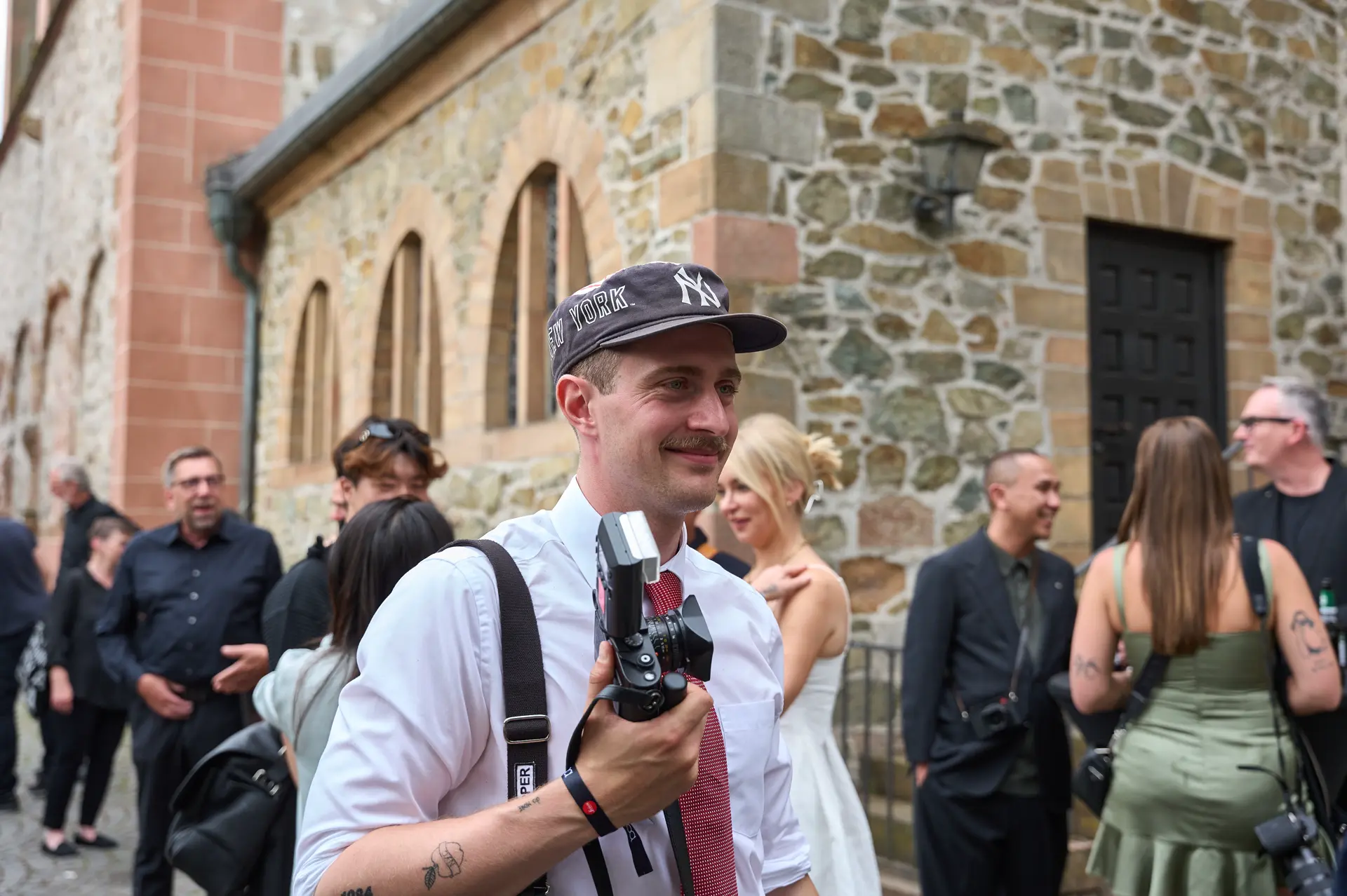 Leica Century Celebration Wetzlar Paul Hepper photographer infront the Wetzlarer dom with a leica camera in his hand