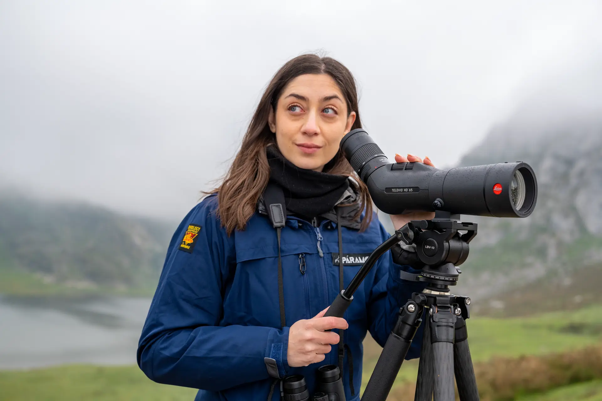 Woman is looking through her Leica Televid HD spotting scope