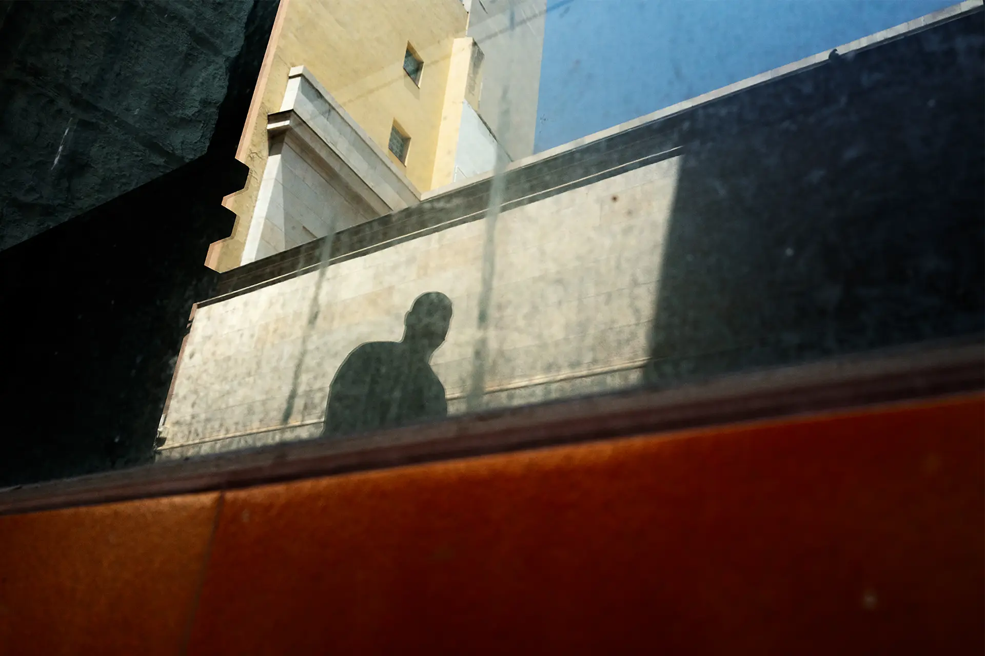 Reflection of a woman in a building
