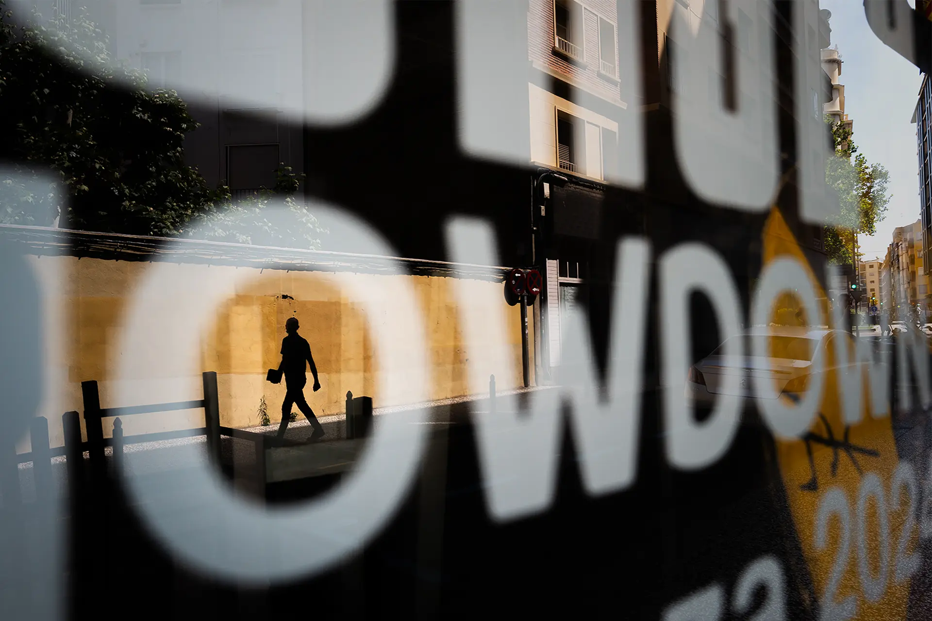 Reflection of a woman in a shop window