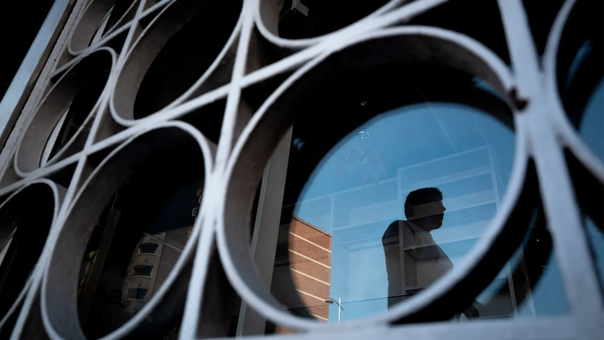 Reflection of a man in a building