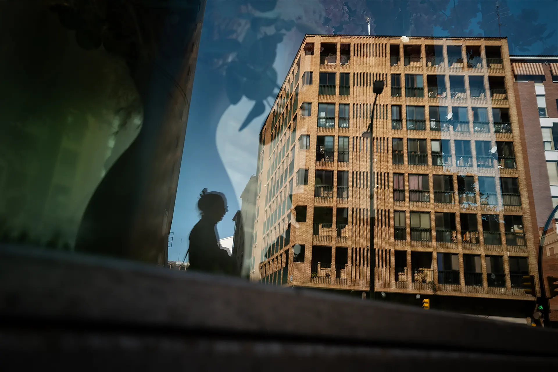Reflection of a woman in a building