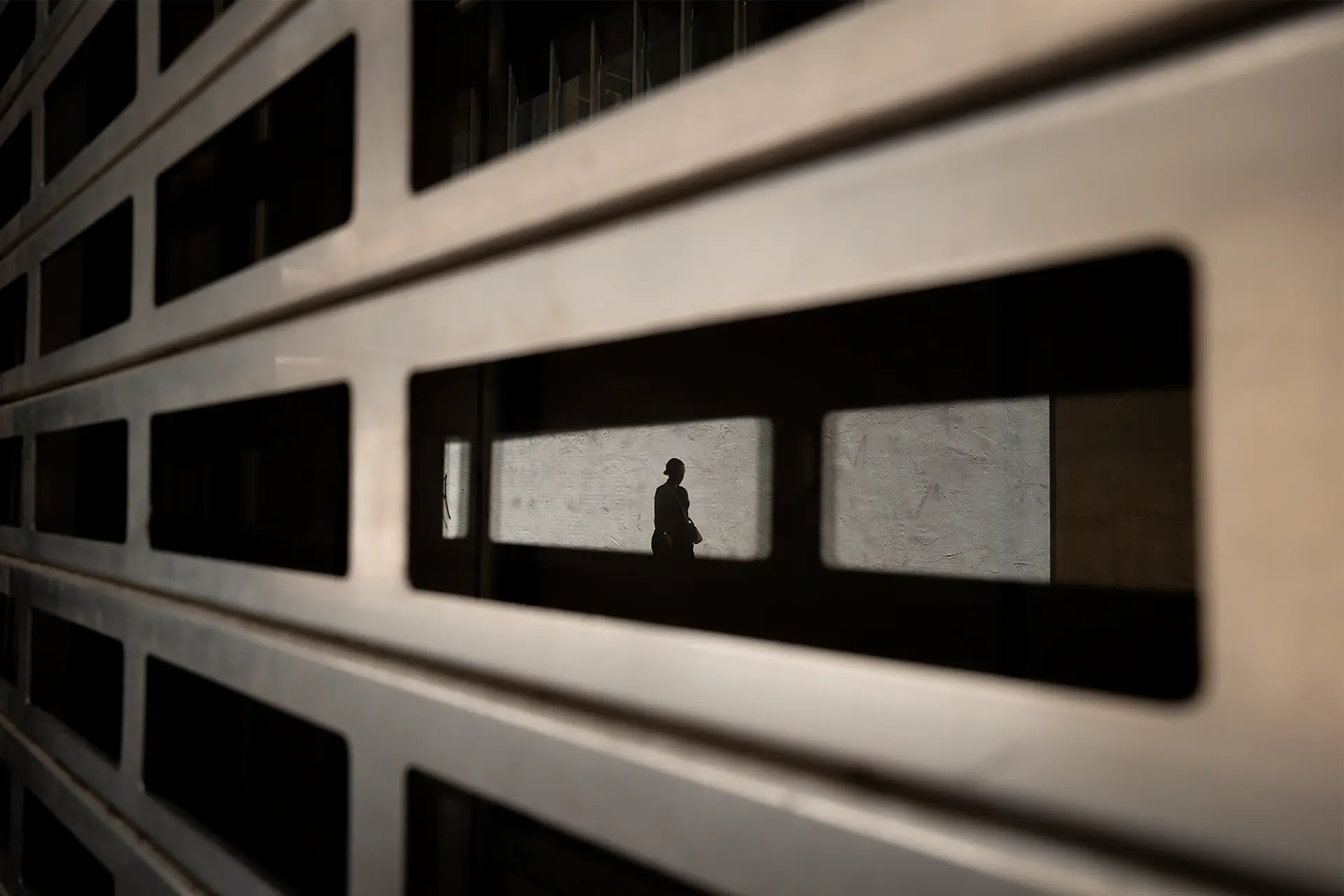 Reflection of a woman in a building