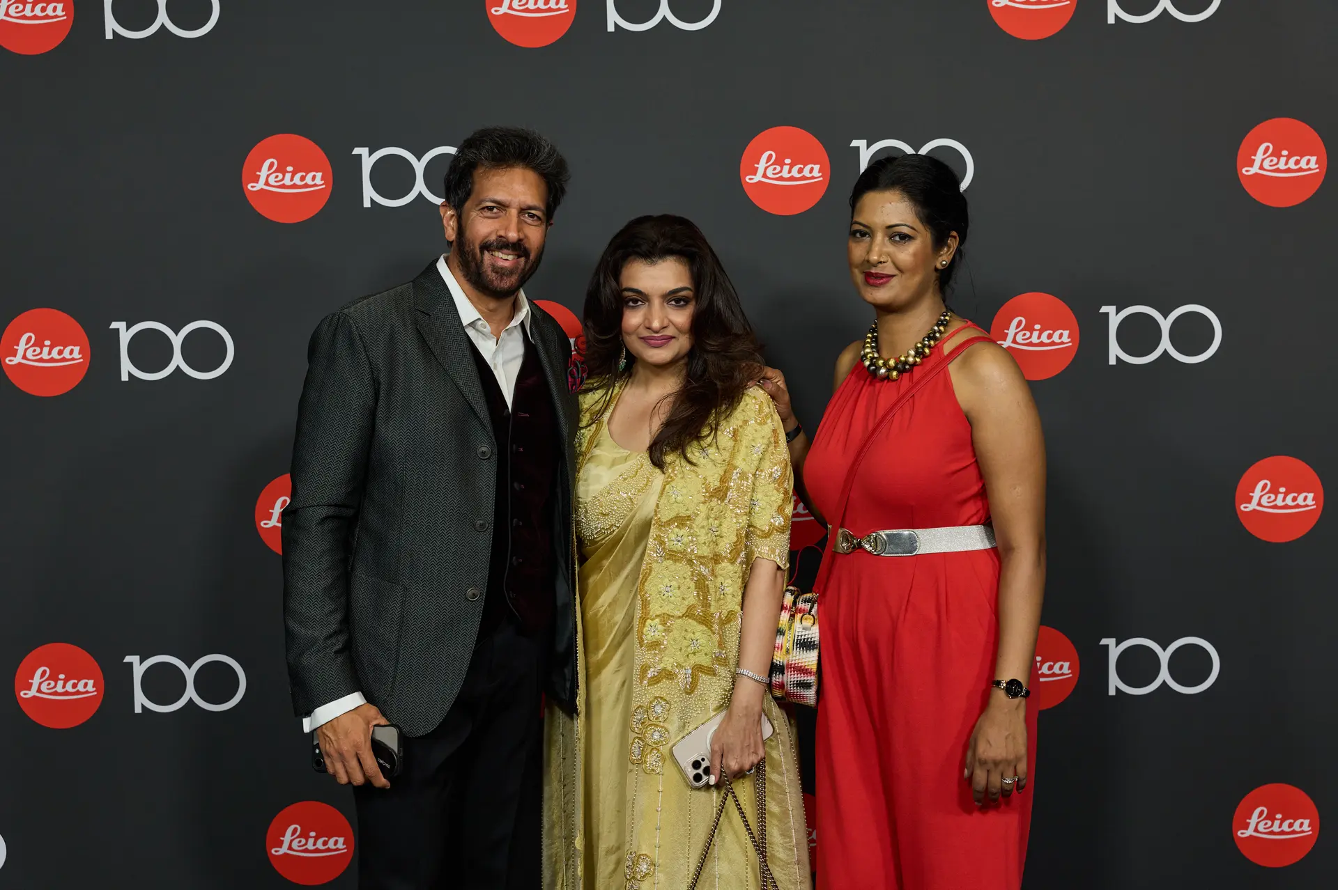 Leica Century Celebration Wetzlar Gala Dinner Guests in front of 100 Years Leica Wall