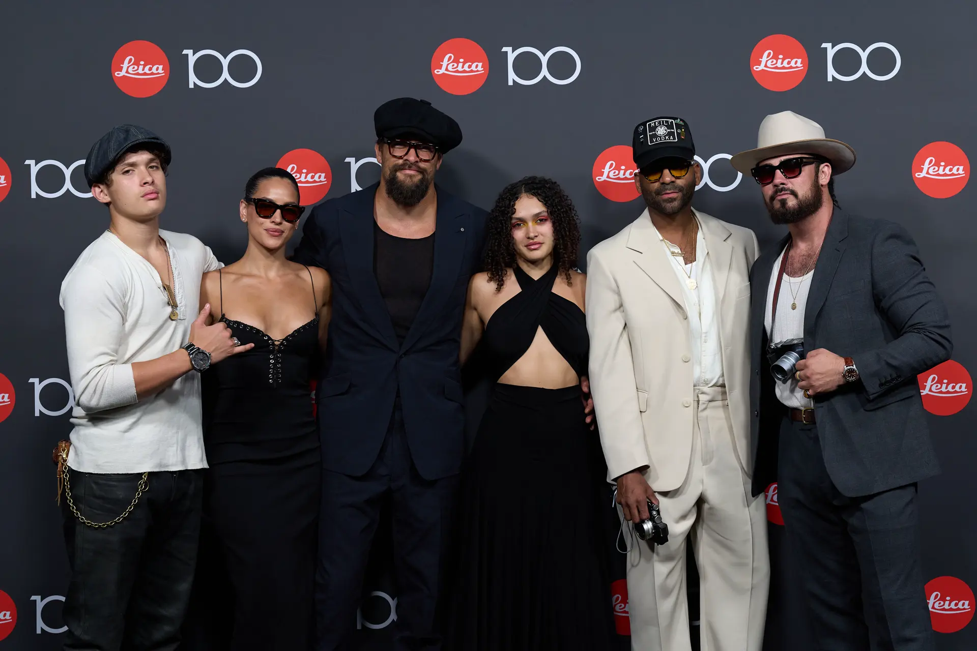 Leica Century Celebration Wetzlar Gala Dinner Jason Mamoa with family and friends in front of 100 Years Leica Wall