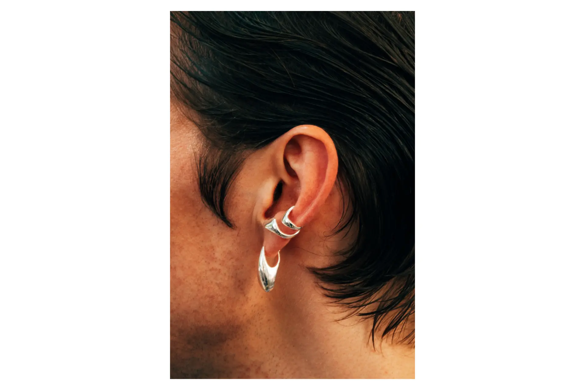 Ear with silver earrings