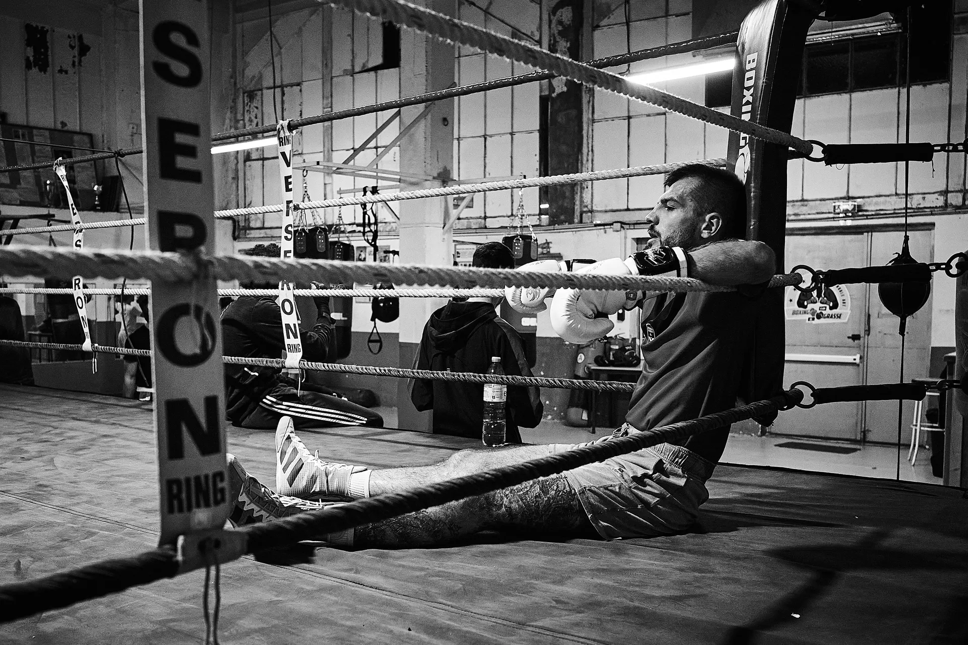 Man sitting in a boxing ring