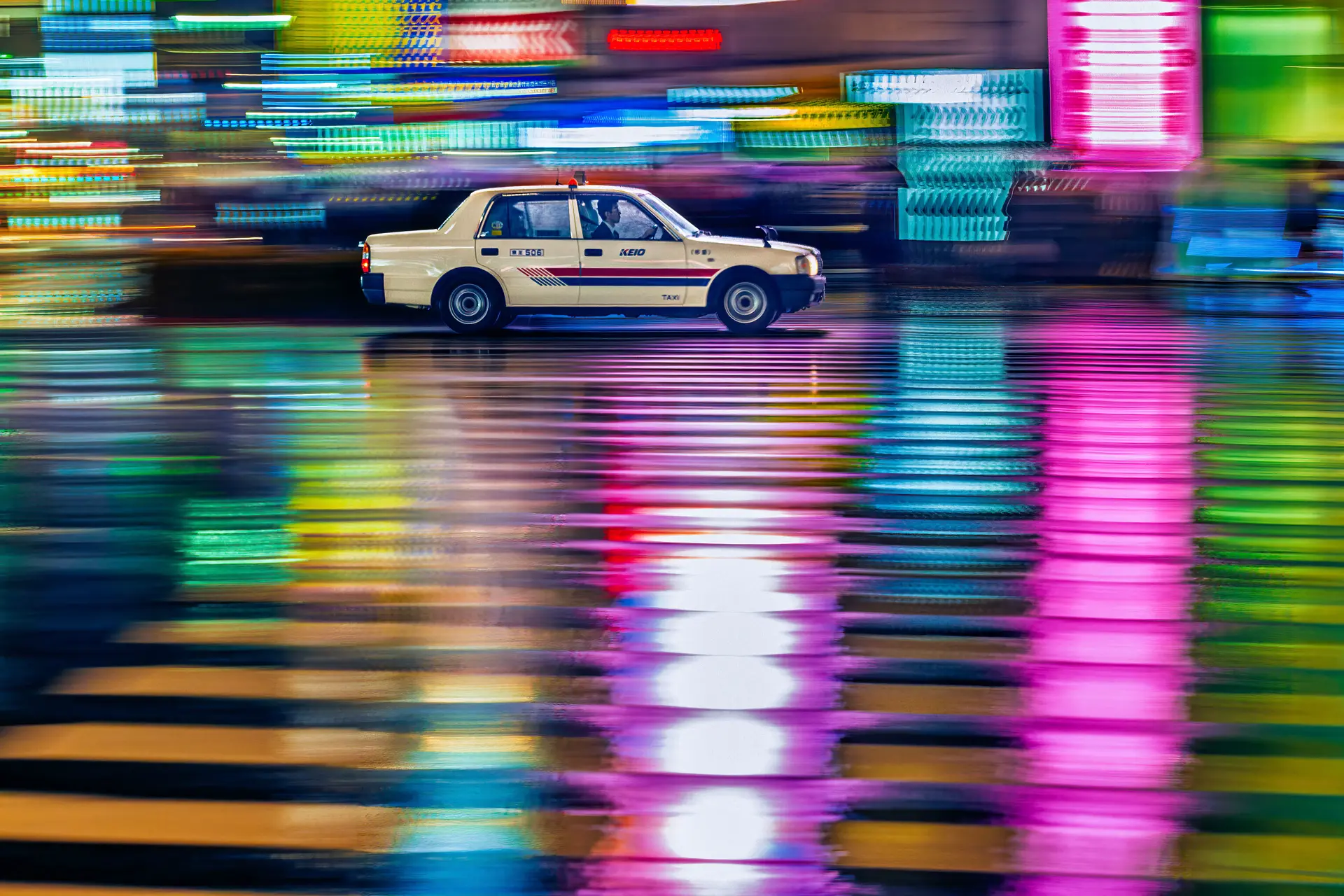 Taxi driving at night in a city with lights