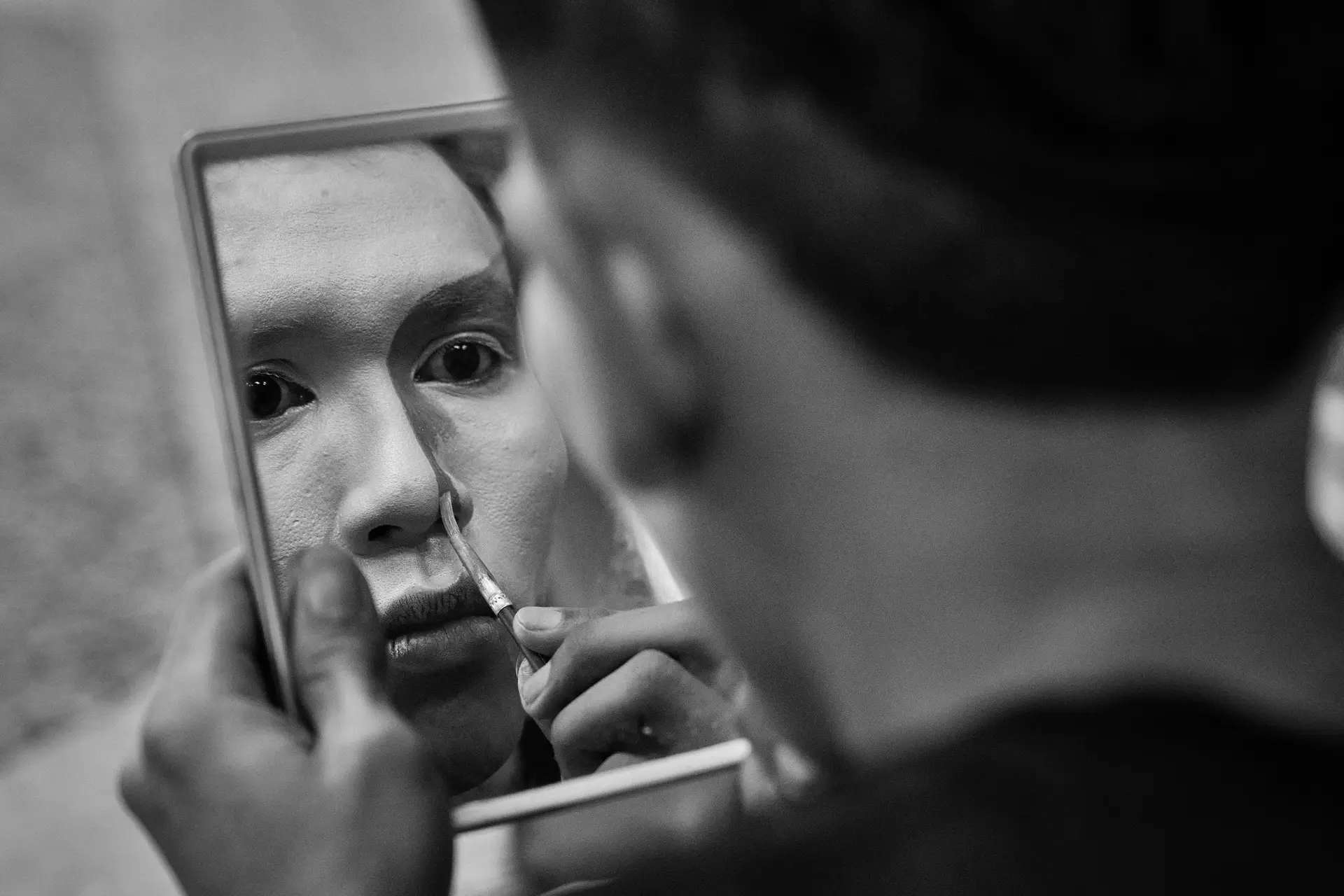 Person looking in the mirror