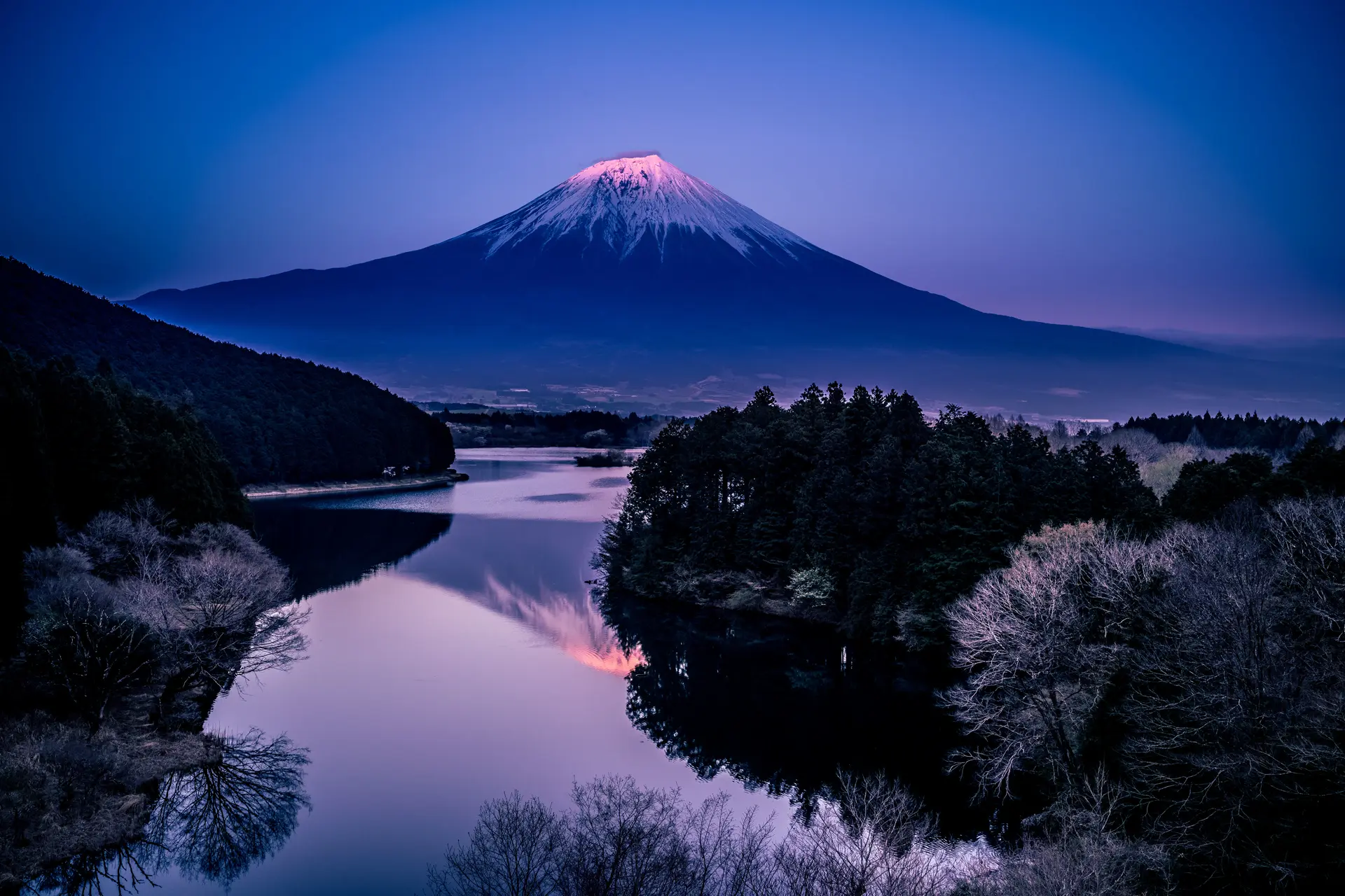A landscape picture of a mountain at night