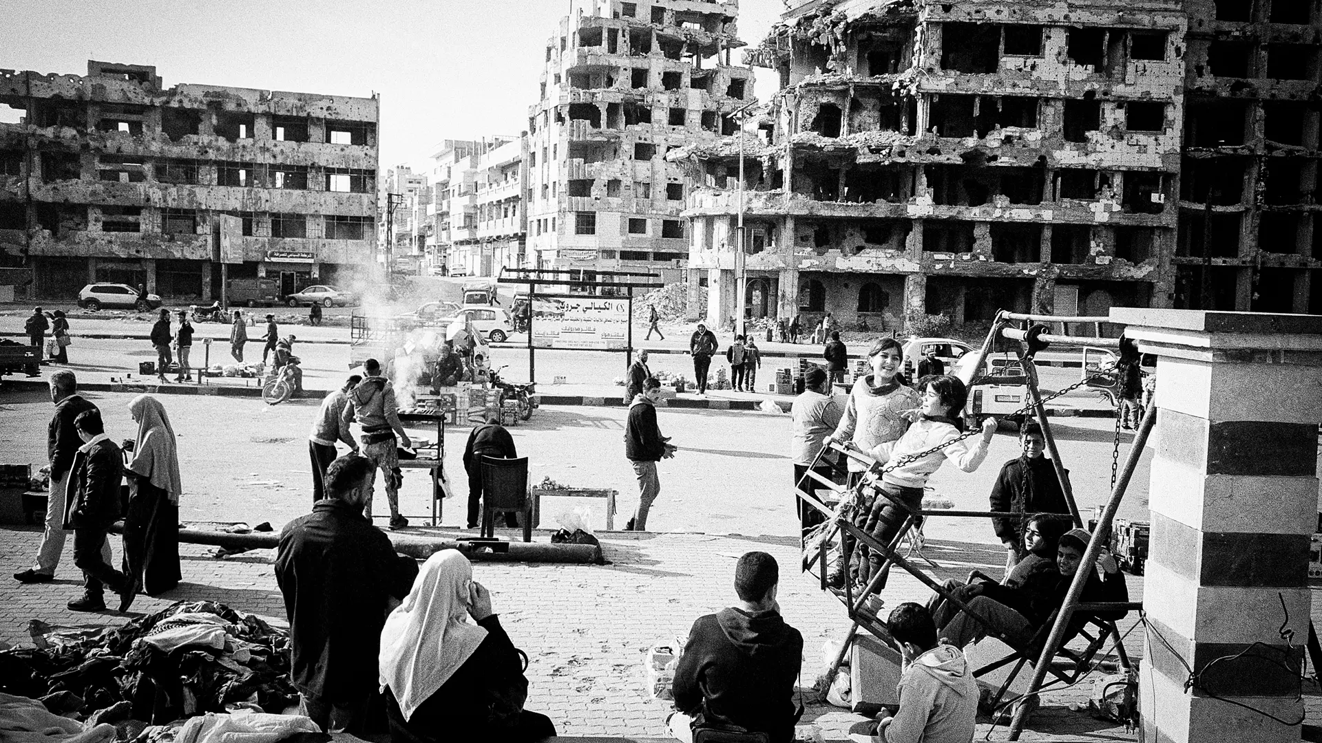 Syria after the fall of the regime in 2024. Many people in front of old ruins
