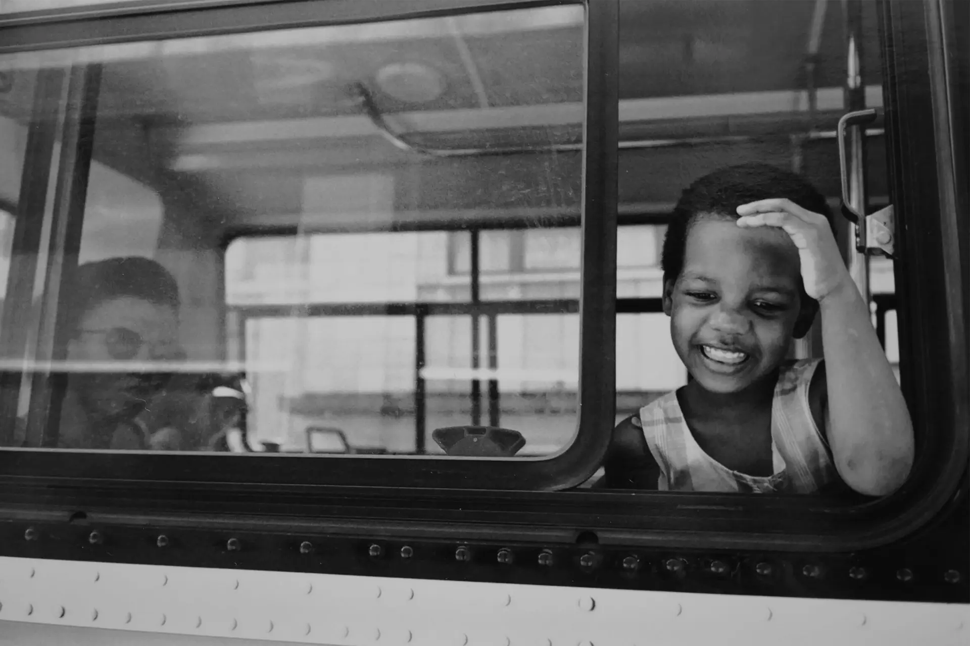 Coloured girl looking out of the bus window