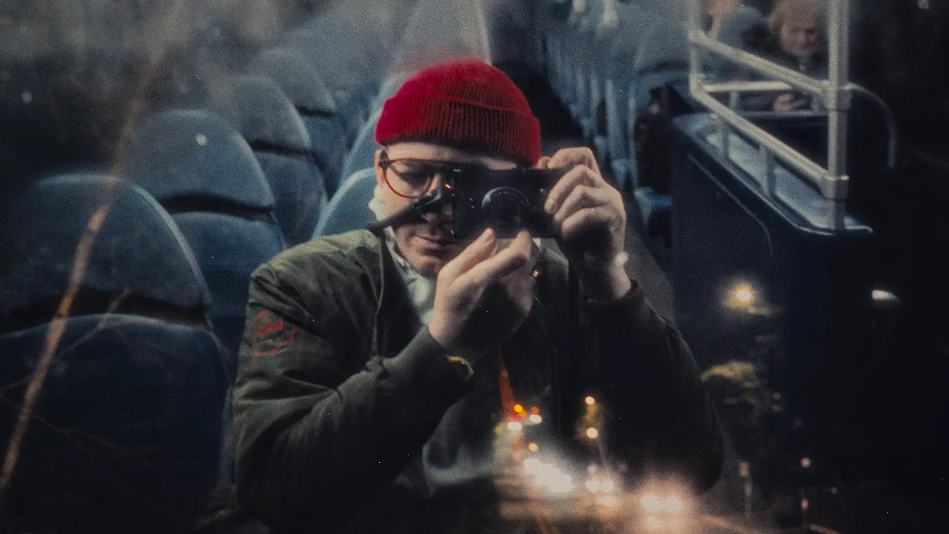 Man in a Bus with leica camera