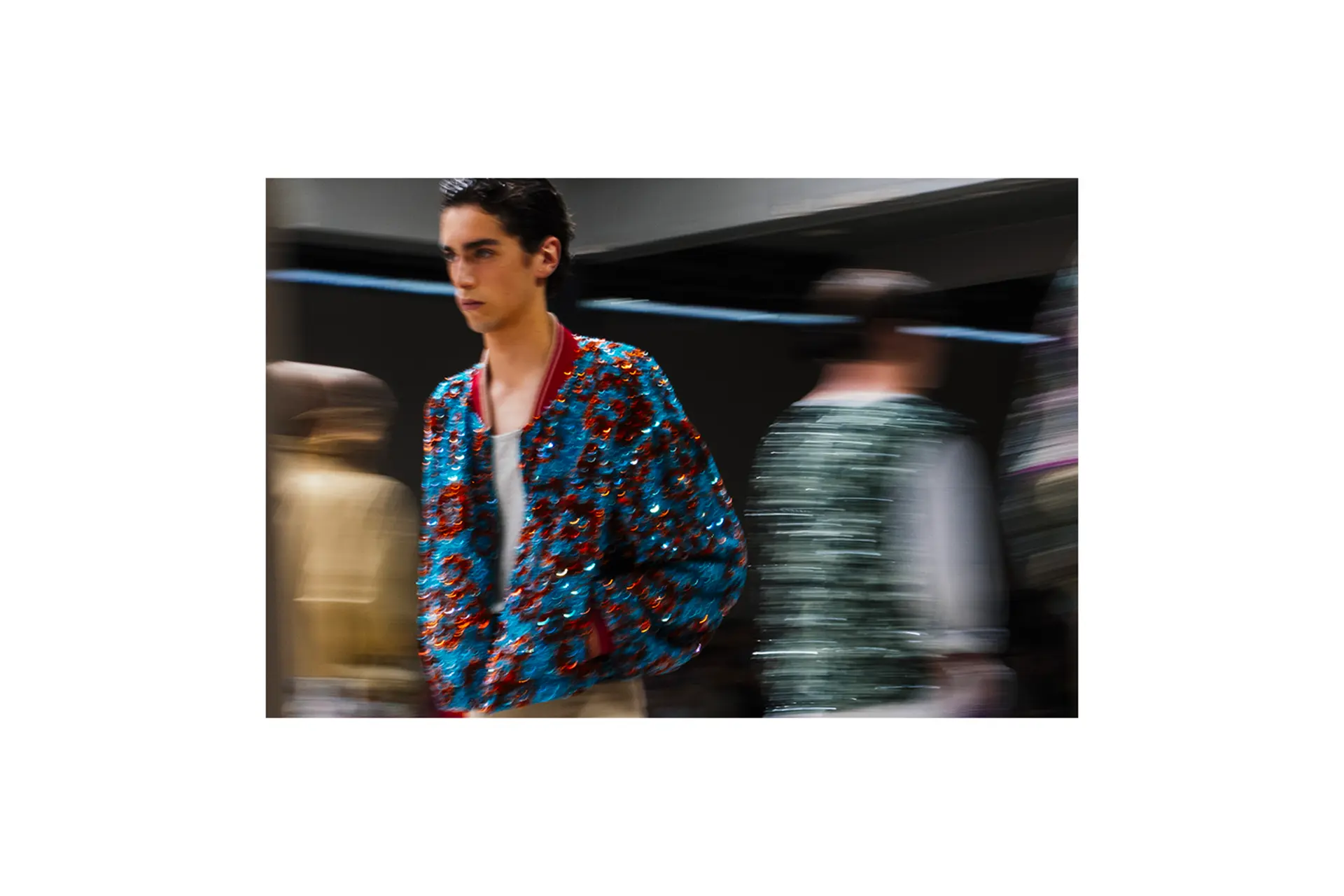 Models on the runway. Models in the background are blurred