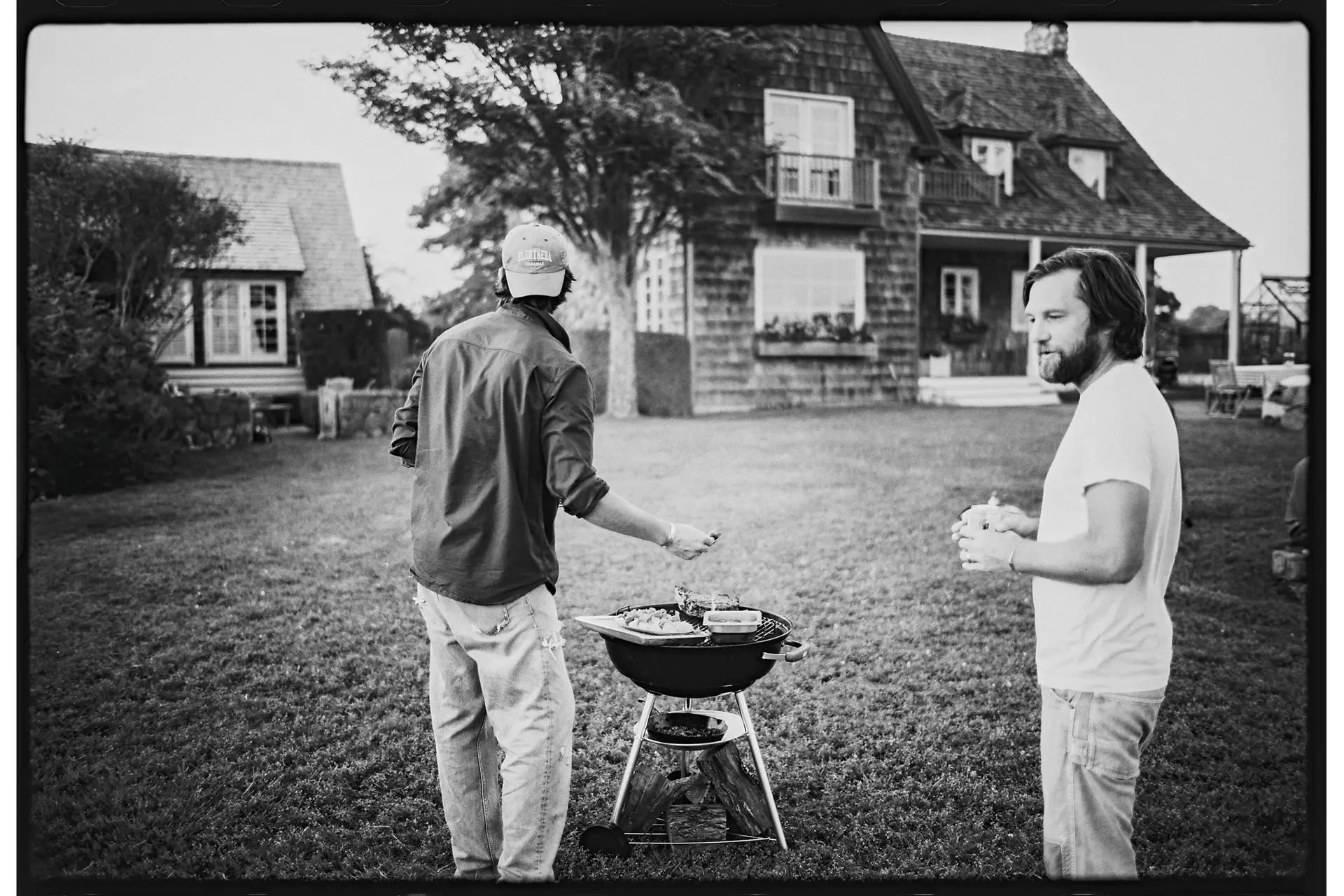 Friends barbecuing in the garden