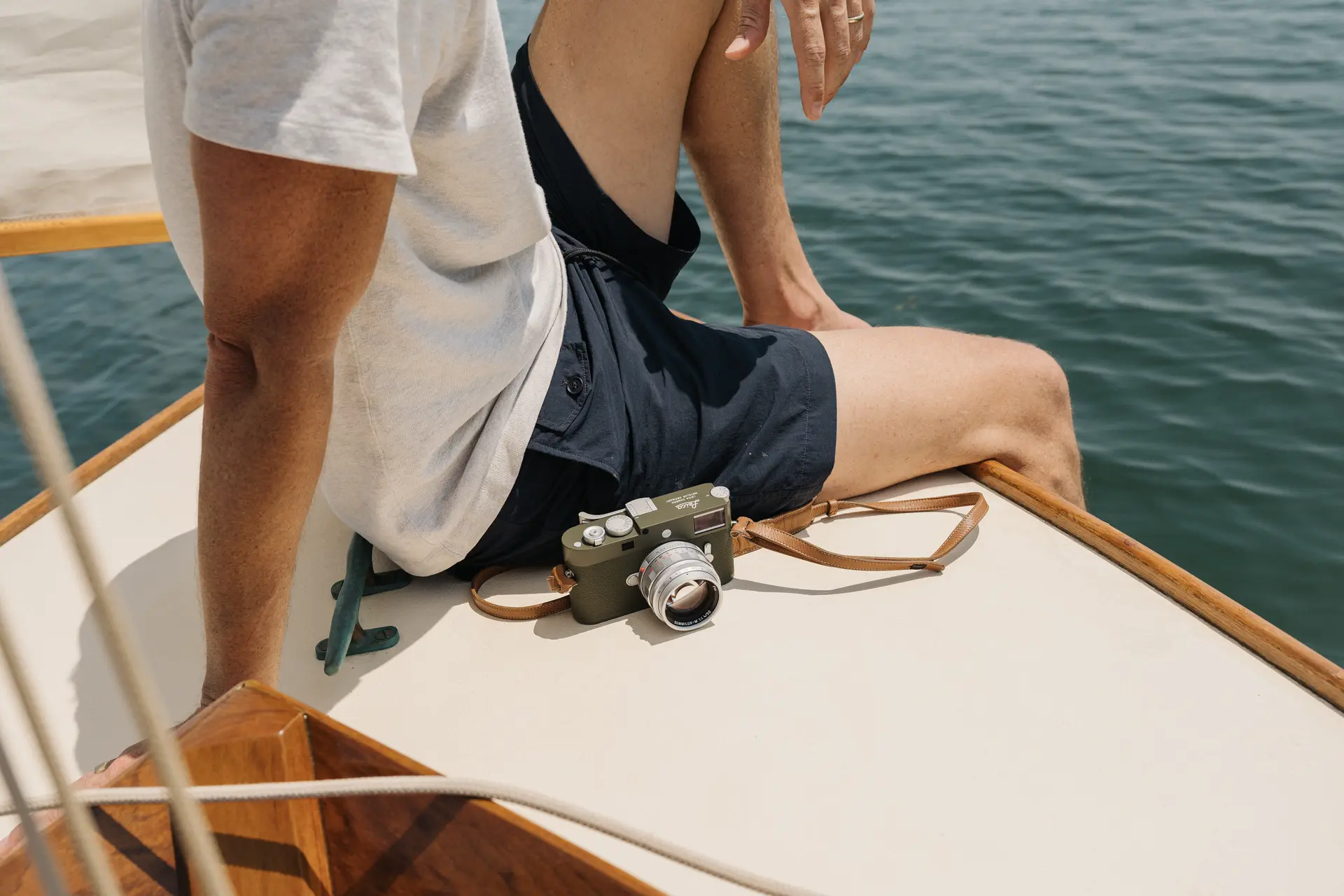 Riley on a boat with his Leica M