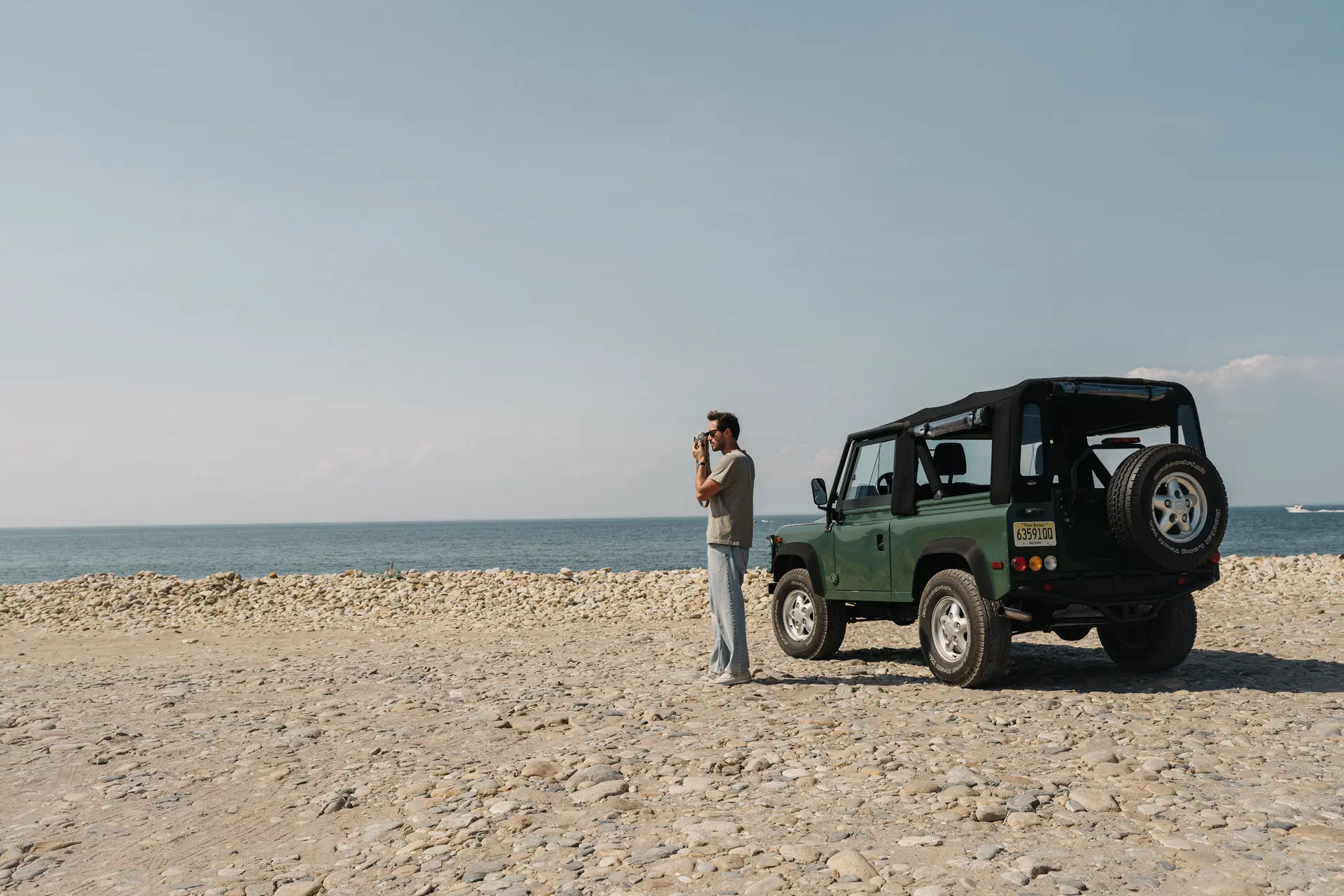 Riley with his car on the beach