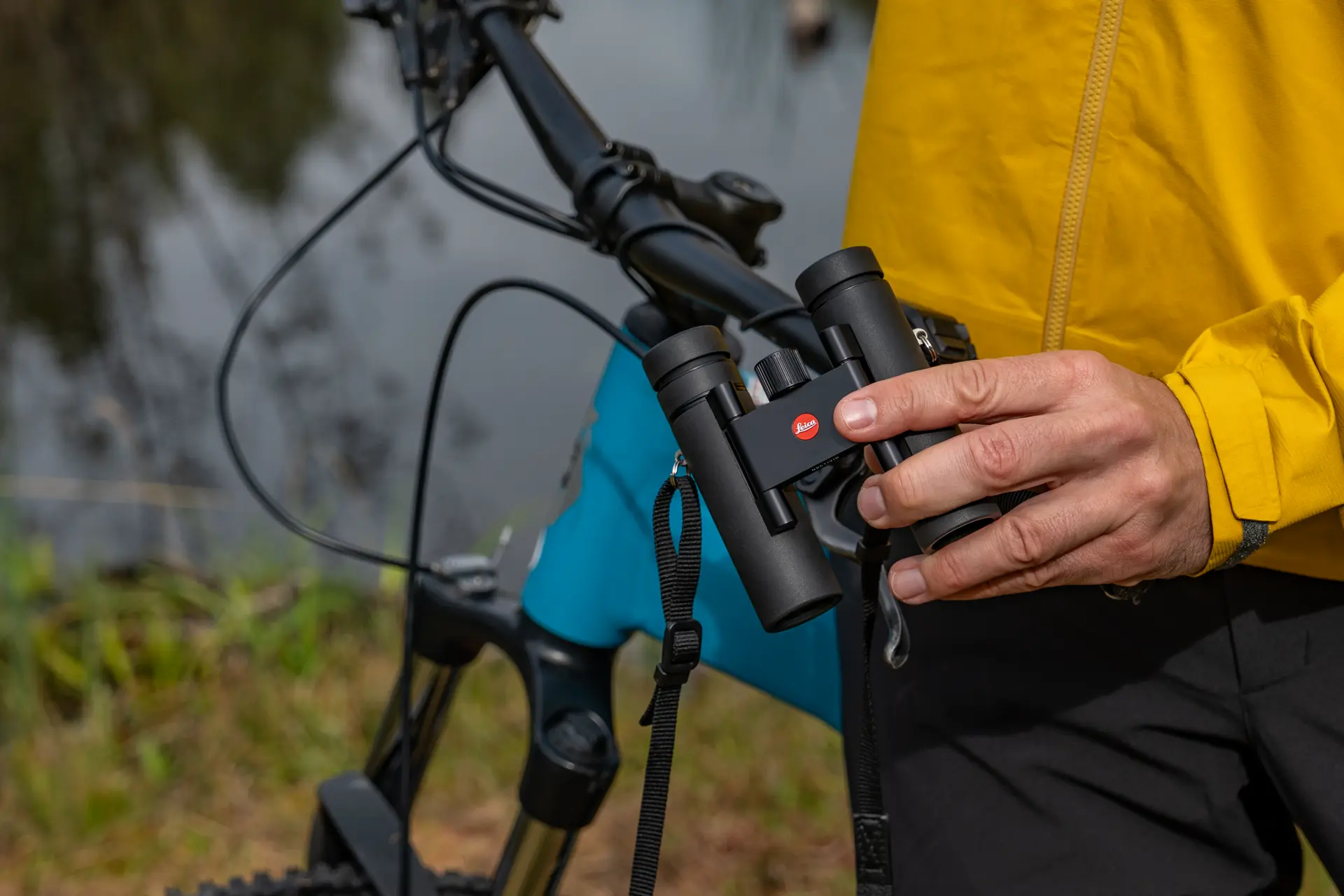 Cyclist with his Leica Noctivid Compact