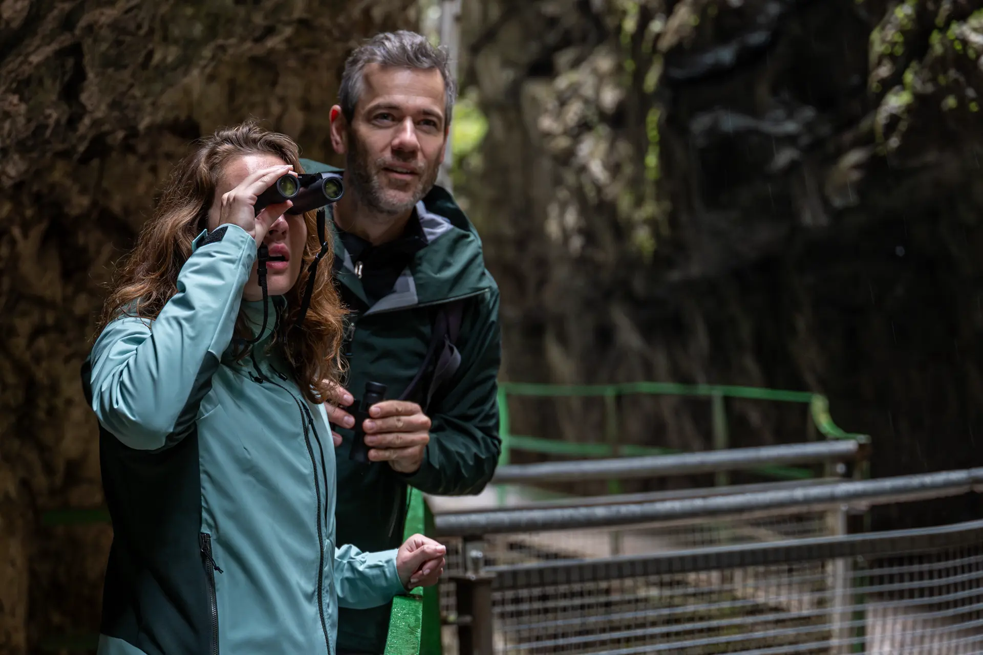 Woman and man are looking through their Leica Noctivid Compact