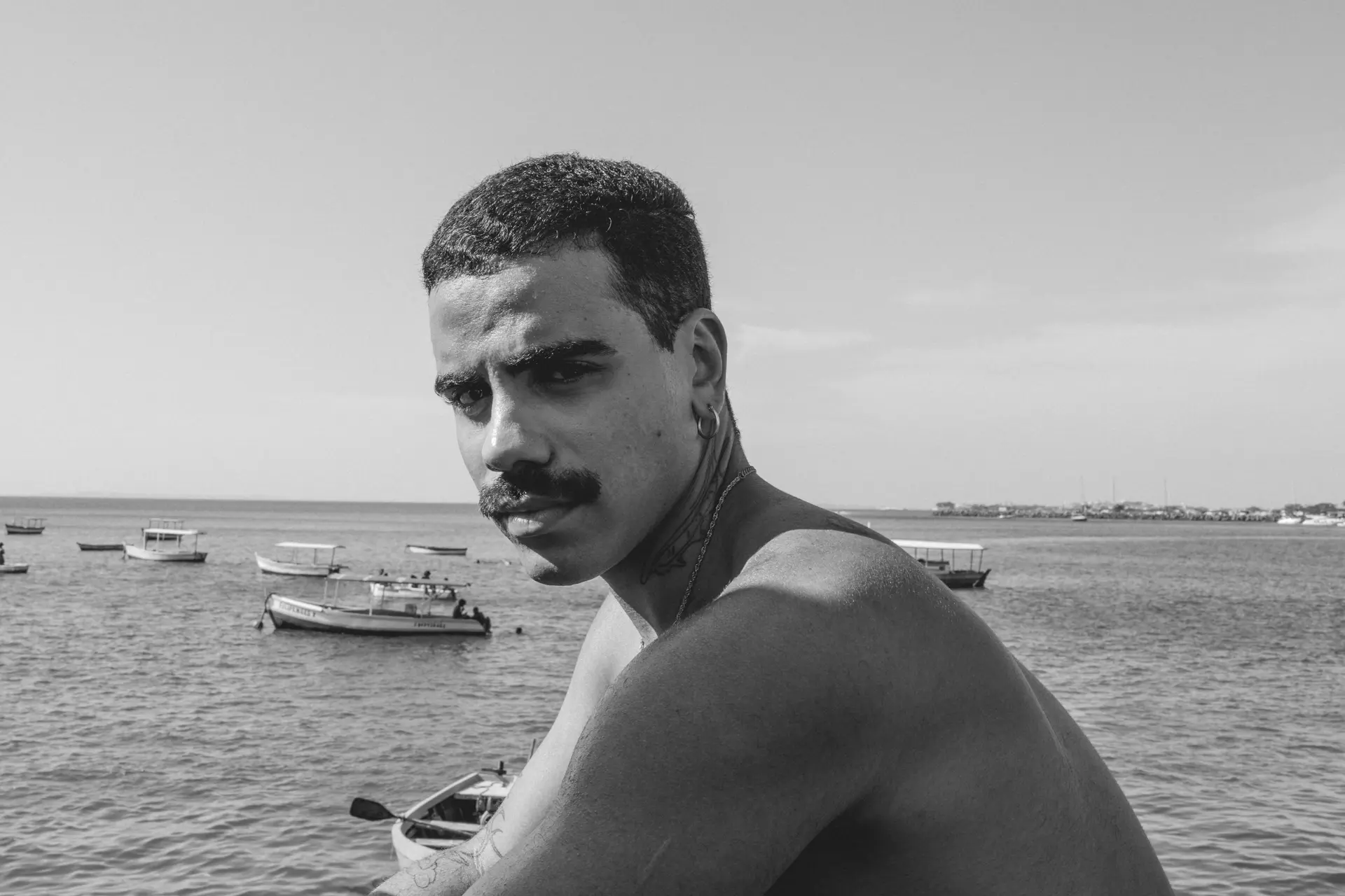 Black and white of a man by the sea