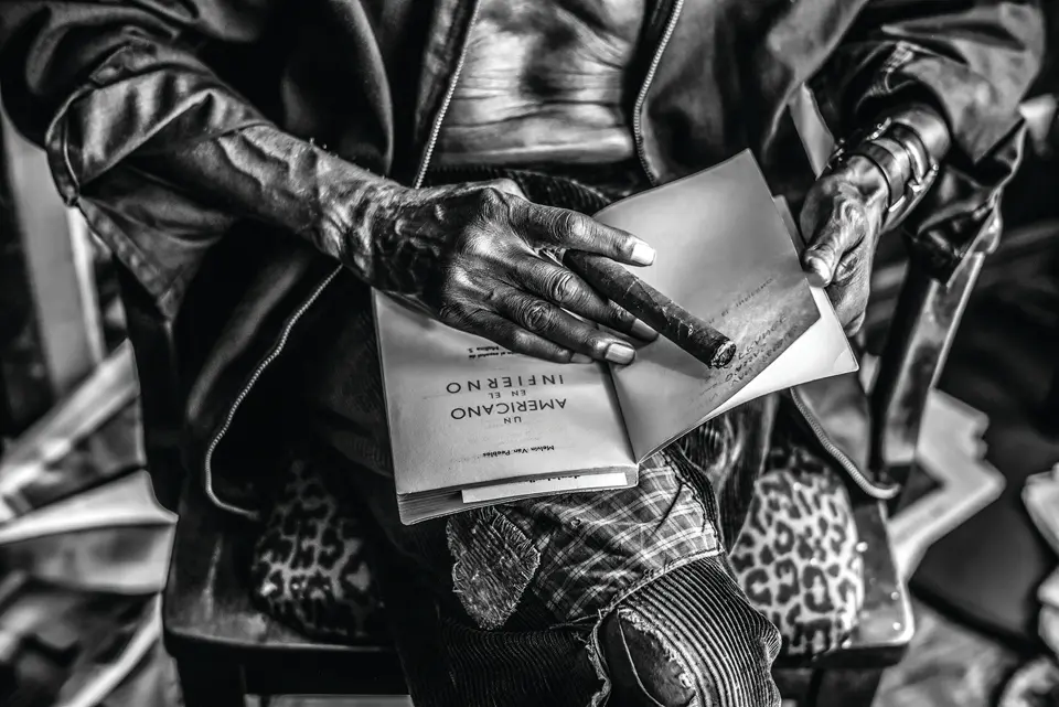 Man with cigar and book