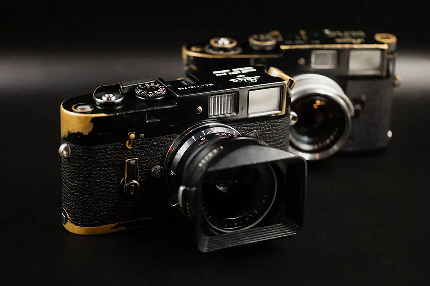 Leica M4 Black Paint with another vintage camera in the background. 