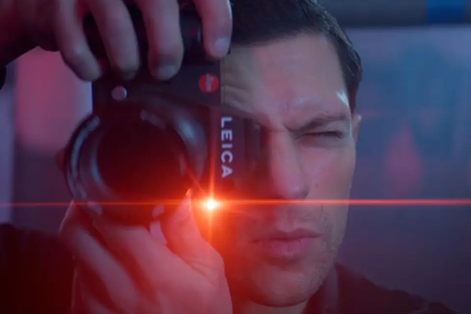 Man takes photo with a Leica SL3 