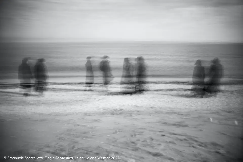 Disappearing scene in black and white with people