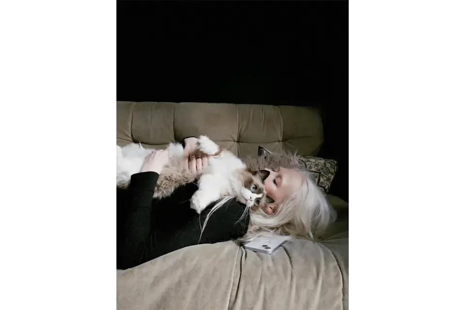 Portrait of a woman with her cat