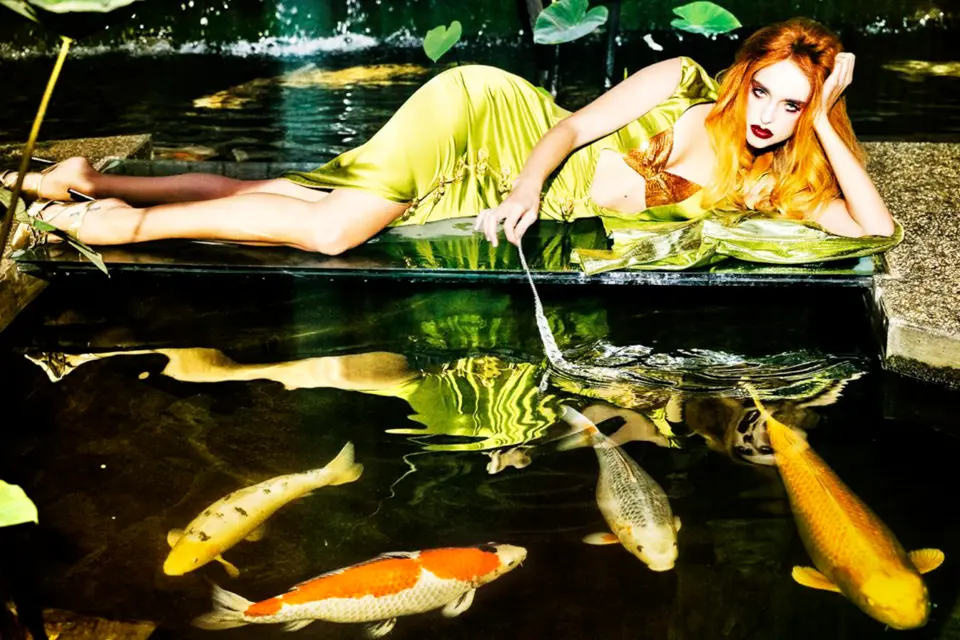 Woman lies close to the lake