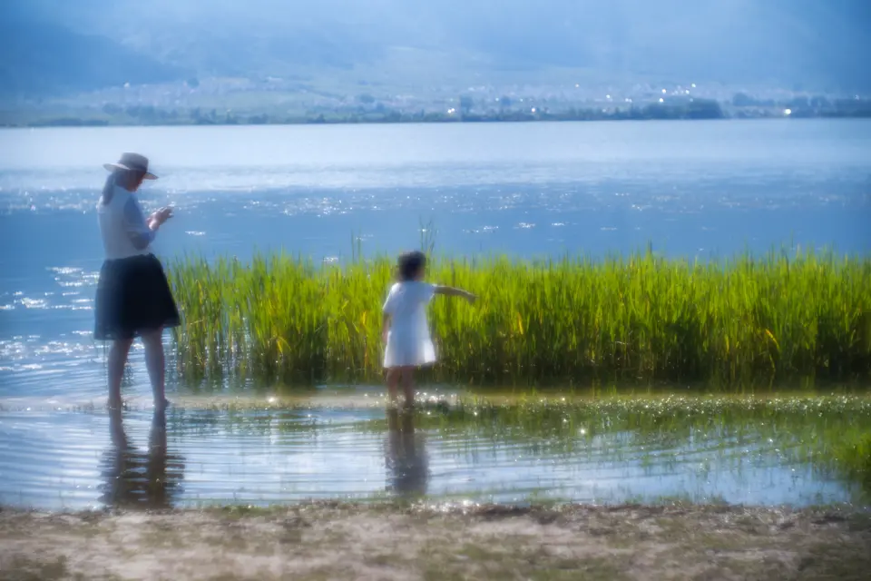 Woman with his child in the nature