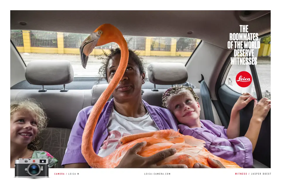 Woman with 2 children and a flamingo on her lap in a car