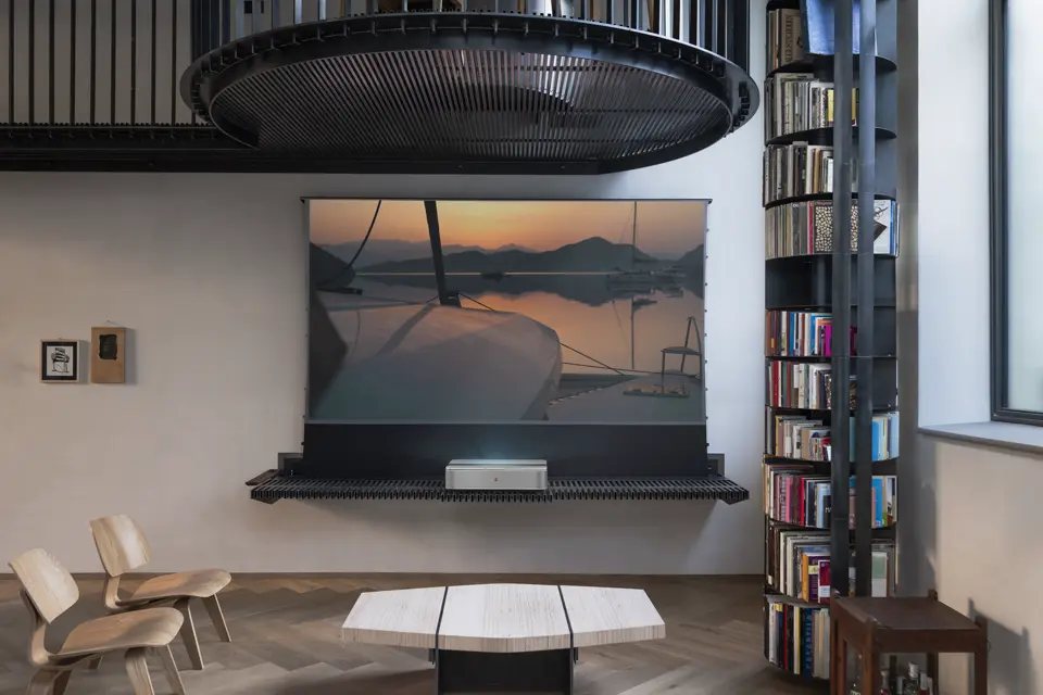 TV furniture with a motorised celexon screen designed for Leica by Nisi Magnoni standing in a living room.