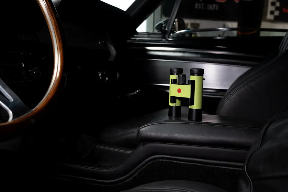 The Leica Ultravid Compact in the color apple green in a vehicle