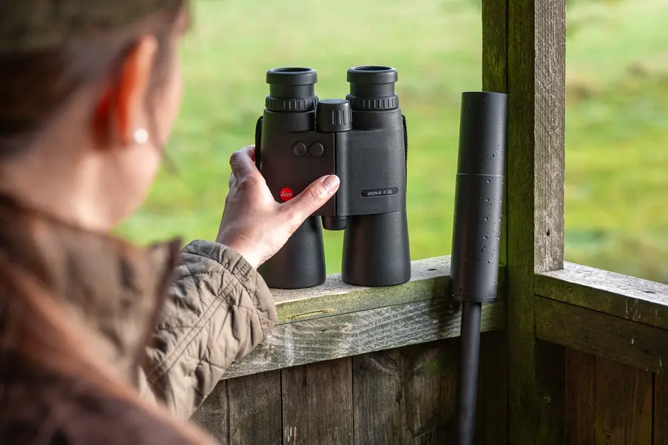 Hunter-watching-from-a-high-stand-with-a-Leica-Geovid-R-SE-hunting-binocular-in-your-left-hand-binoculars