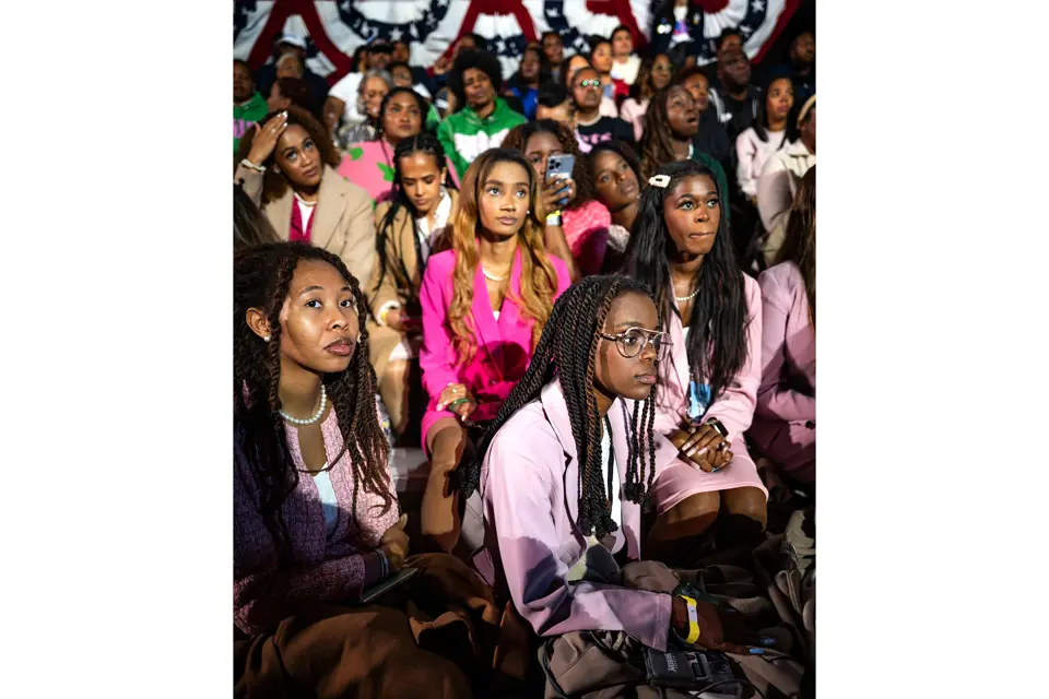 Group of young women listen to something