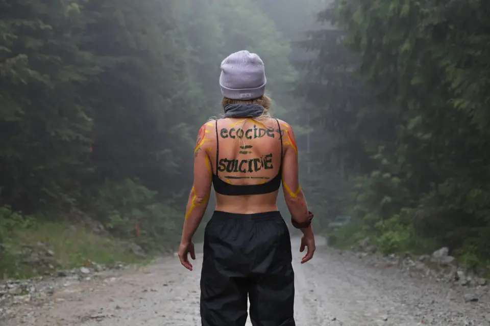 A woman appeared at a cut block to show her unity with land defenders