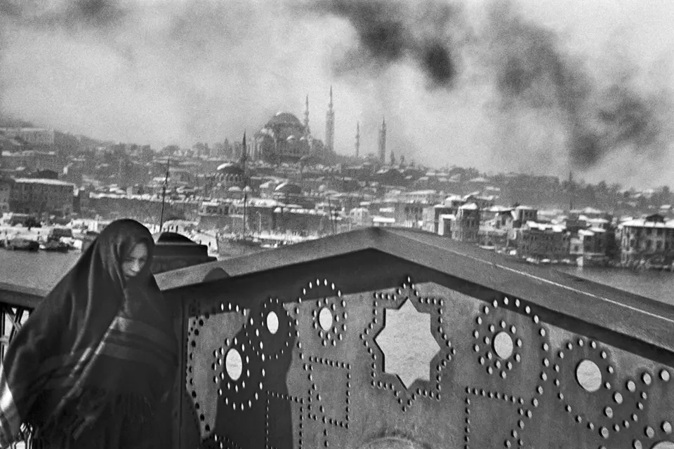 Woman wrapped in a scarf over the rooftops of Istanbul