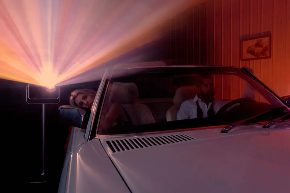 Couple watches sth on Cine Play in Car
