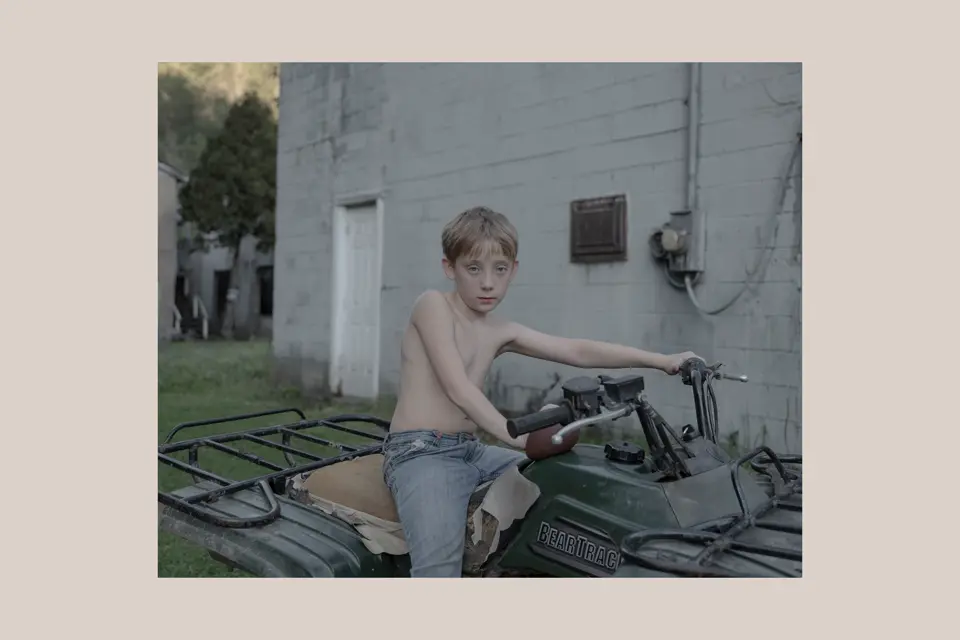 young boy on an quad