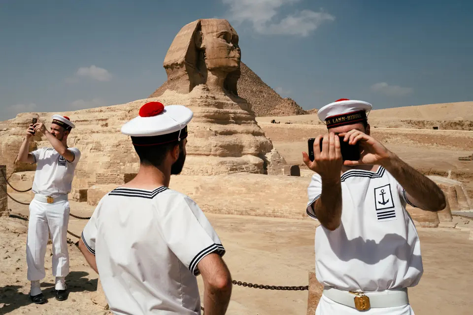 Sailors taking pictures in front of the Sphinx Giza in Egypt